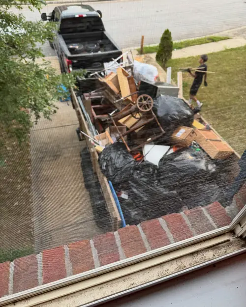 Construction Debris & Hauling crew loading items