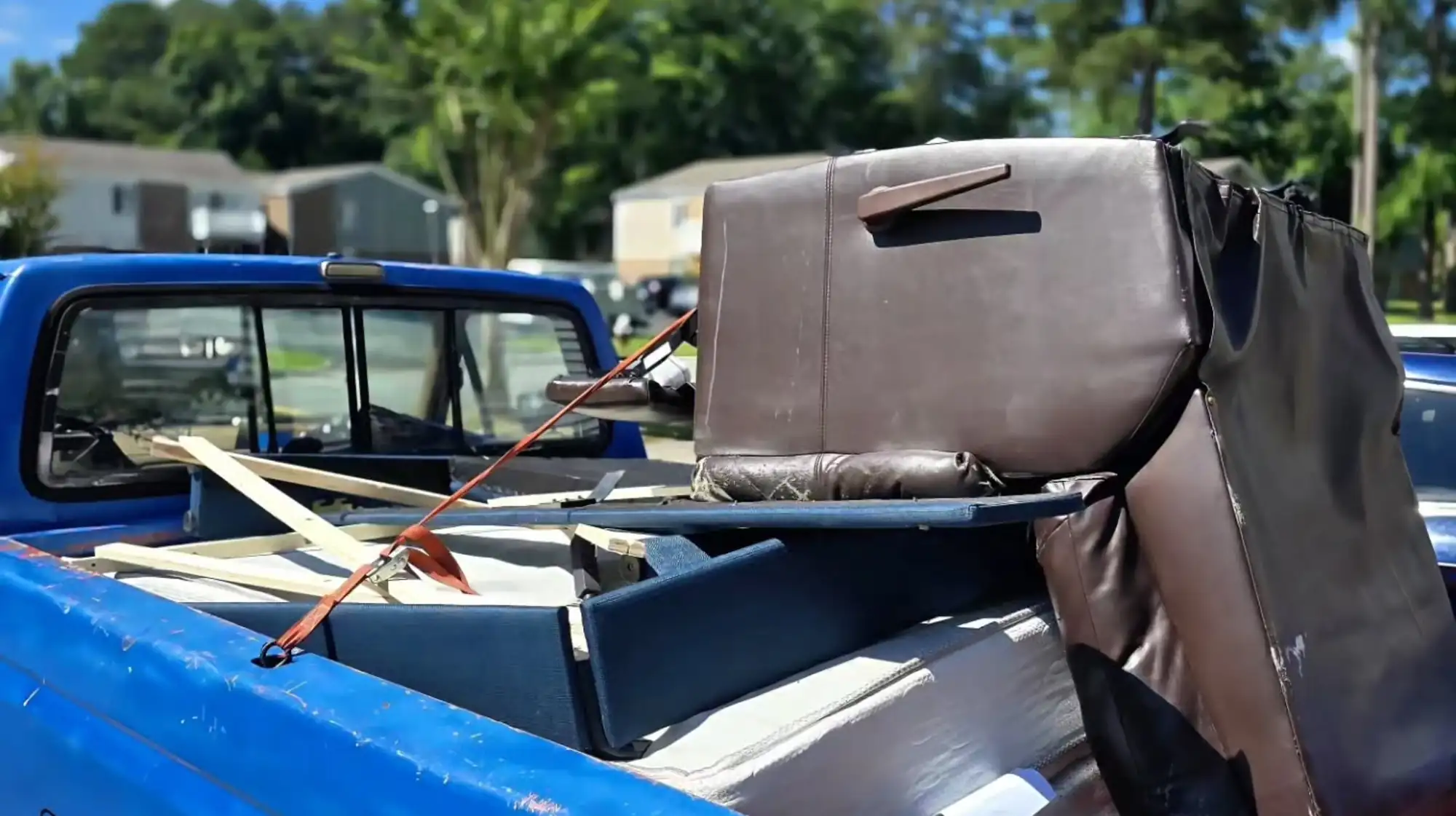 pickup truck hauling old furniture in Valrico