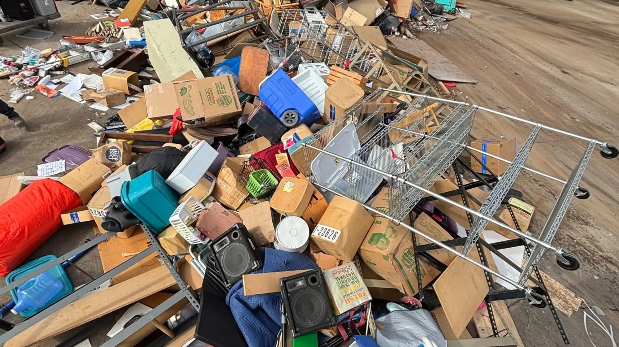 mixed household junk pile sorted for recycling and donation
