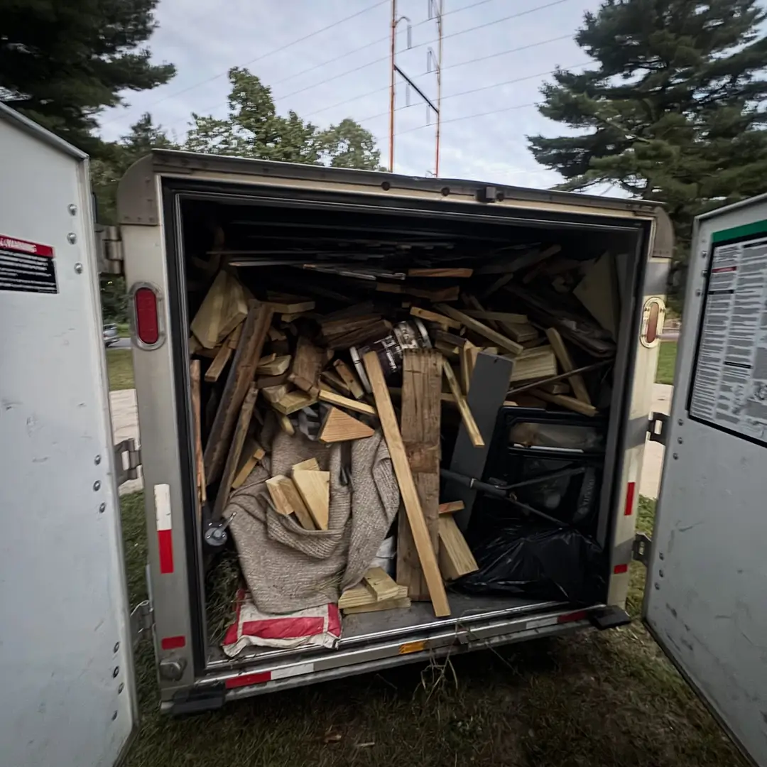enclosed trailer loaded with household junk during cleanout in Seffner