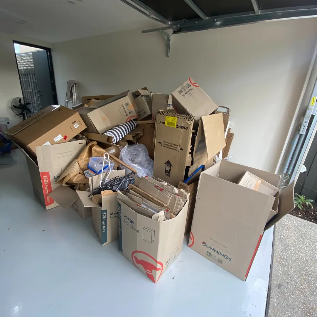 garage full of moving boxes before cleanout in FishHawk