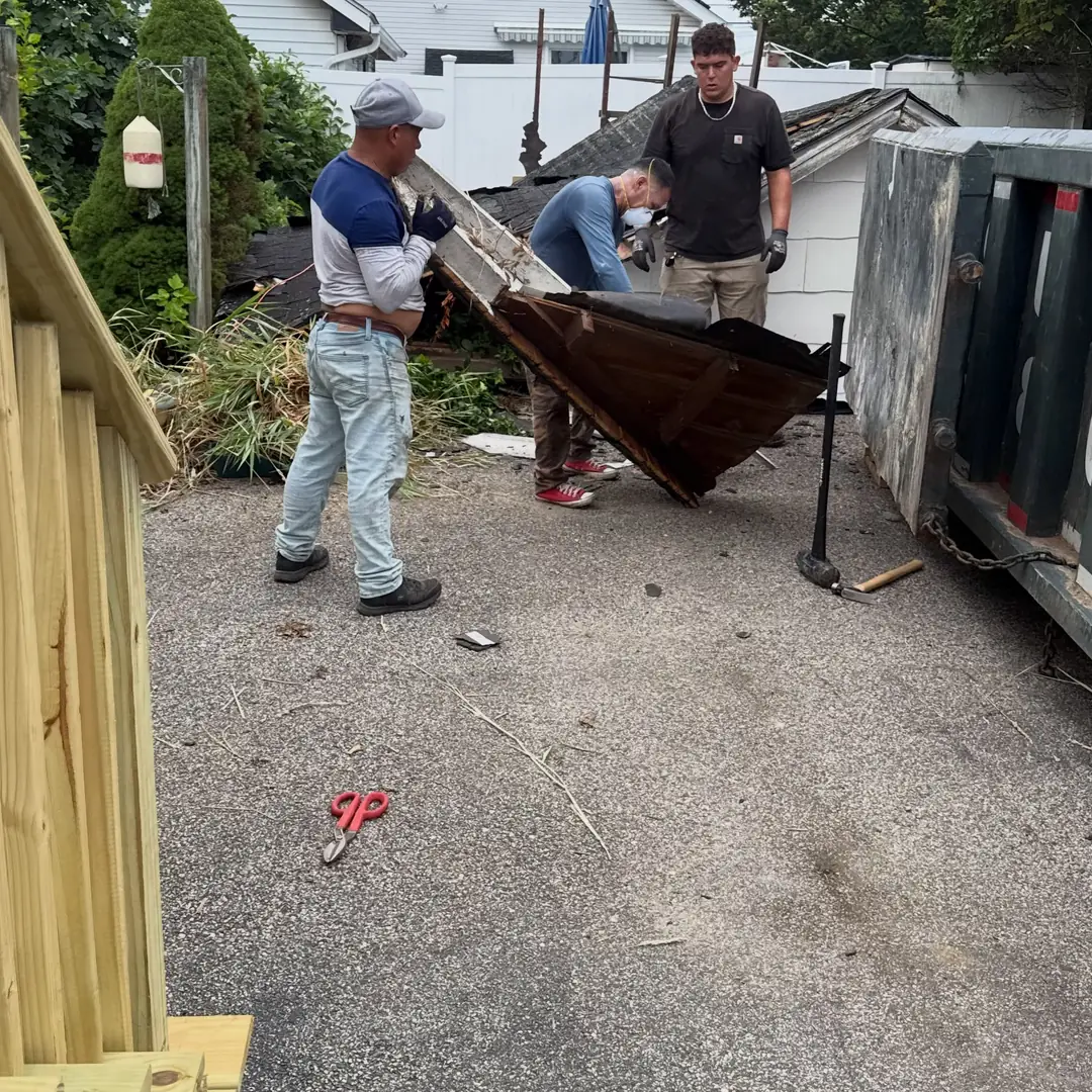 old wooden shed being demolished in Dover FL backyard